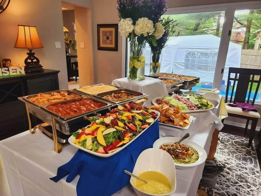 A catered buffet line of hot trays set up for an event