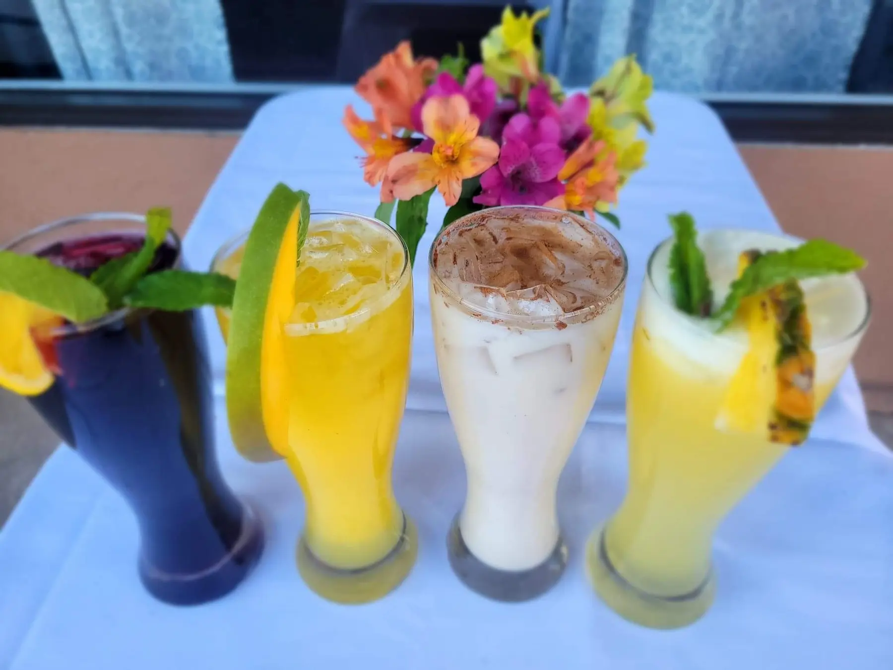 Aguas frescas and fruit drinks garnished with flowers