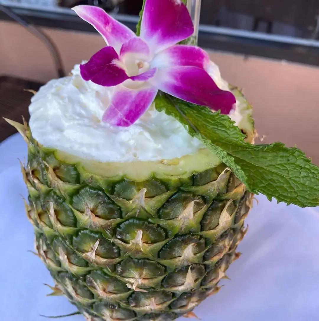 A drink served in a pineapple