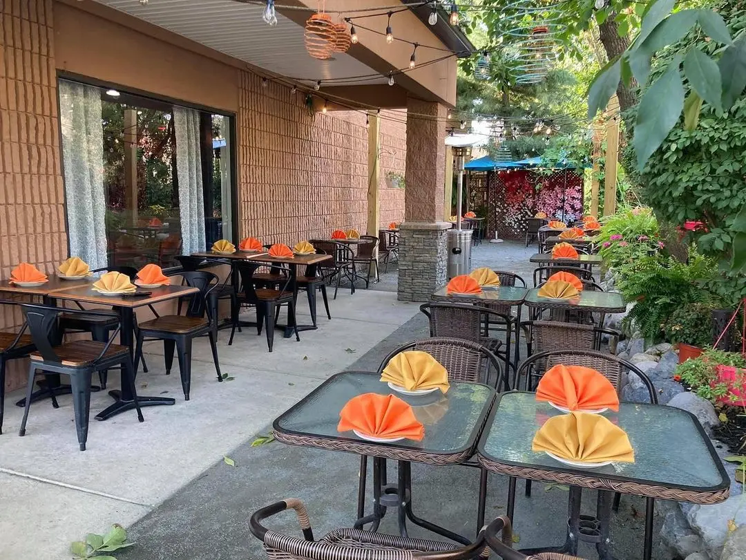 Patio tables along the garden wall